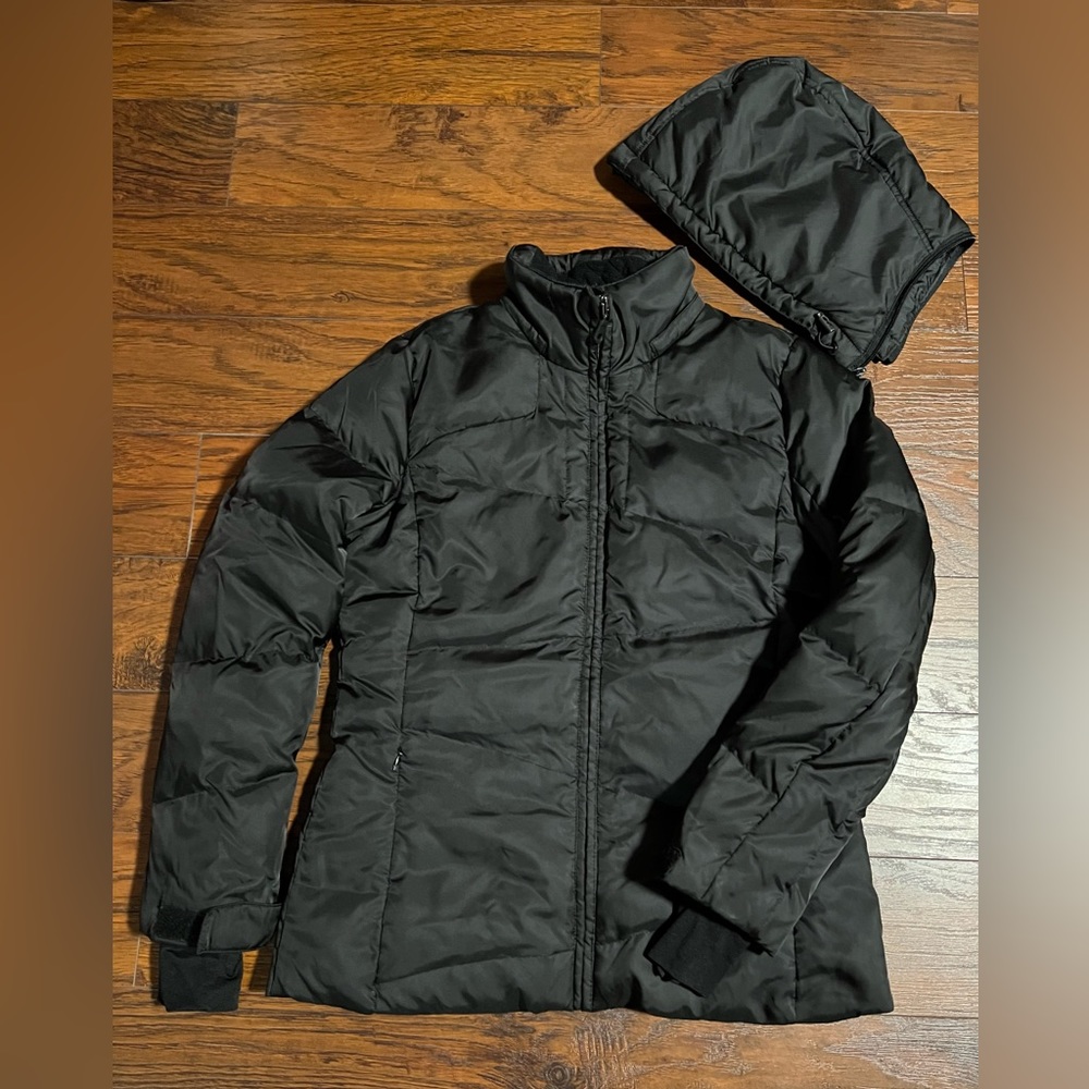 Black puffer jacket by Nautica with detachable hood.